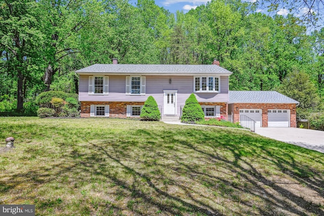 1176 Goldfinch Ln, Millersville, MD 21108 - raised ranch featuring a chimney, a garage, and a front yard