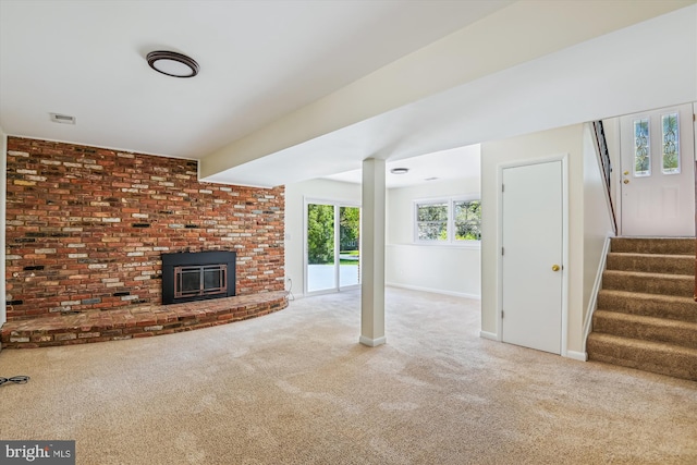 1176 Goldfinch Ln, Millersville, MD 21108 - unfurnished living room featuring carpet, stairway, baseboards, and a fireplace
