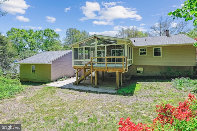 1176 Goldfinch Ln, Millersville, MD 21108 - rear view of property with a sunroom, a chimney, a yard, and a patio area