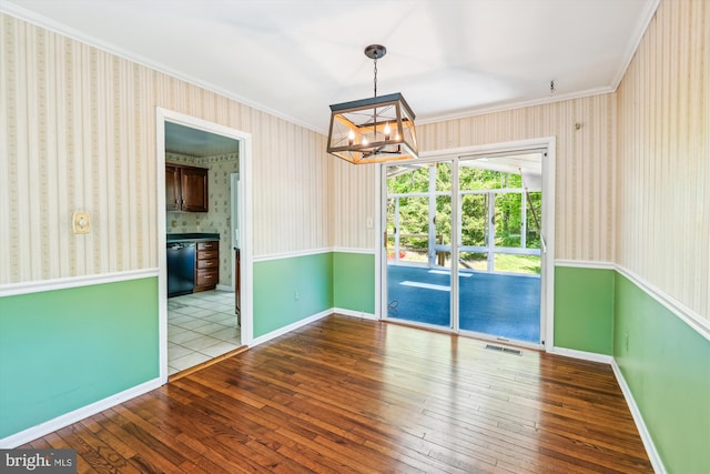 1176 Goldfinch Ln, Millersville, MD 21108 - unfurnished dining area featuring a chandelier, ornamental molding, wood-type flooring, wallpapered walls, and baseboards