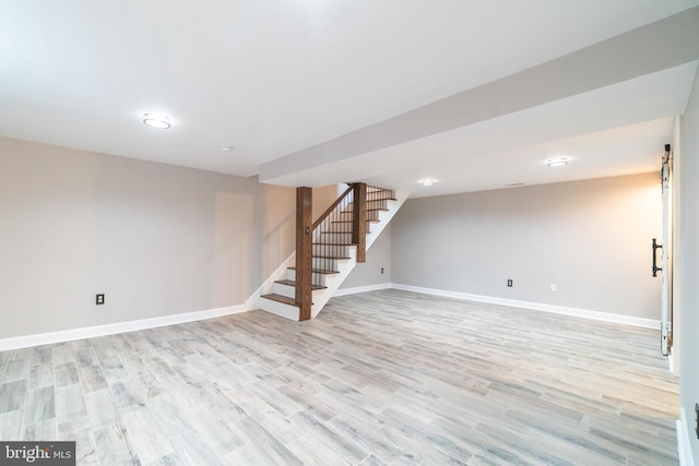 770 Willow Grove Rd, Felton, DE 19943 - finished below grade area with stairway, baseboards, and light wood-style floors