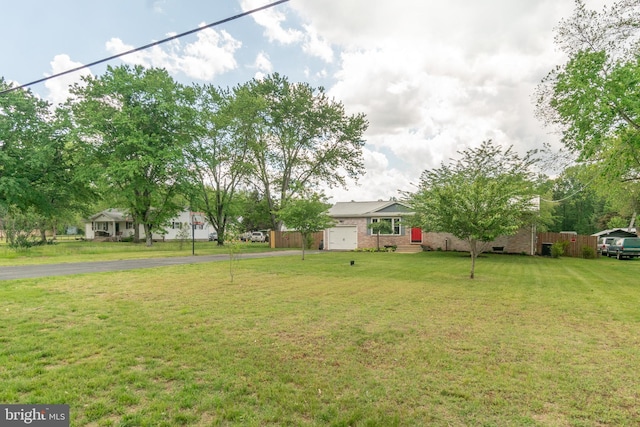 770 Willow Grove Rd, Felton, DE 19943 - view of grassy yard with driveway and a garage