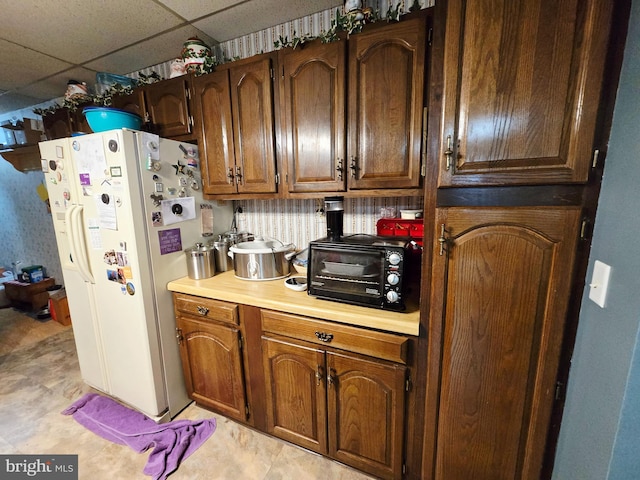 15 Weaver Ln, Brandywine, WV 26802 - kitchen with white fridge with ice dispenser, light countertops, and a paneled ceiling