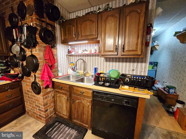 15 Weaver Ln, Brandywine, WV 26802 - kitchen featuring dishwasher, a sink, light countertops, wallpapered walls, and brown cabinetry