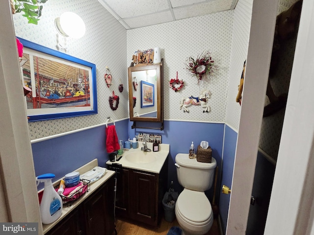 15 Weaver Ln, Brandywine, WV 26802 - half bath featuring wallpapered walls, wainscoting, vanity, toilet, and wood finished floors