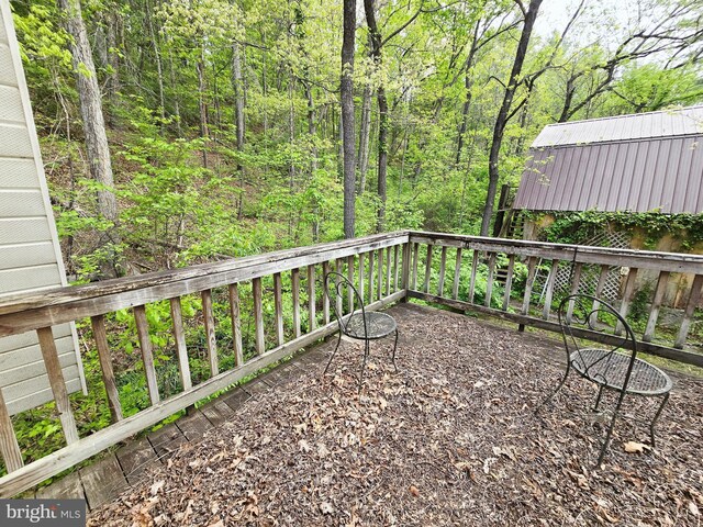 15 Weaver Ln, Brandywine, WV 26802 - view of patio featuring a view of trees and a deck