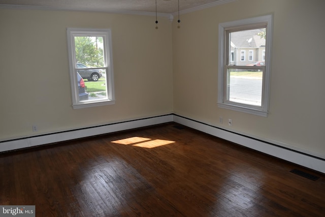 spare room with wood finished floors, crown molding, baseboards, and baseboard heating