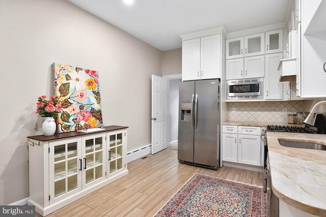 2332 E Baltimore St E, Baltimore, MD 21224 - kitchen featuring stainless steel appliances, backsplash, white cabinetry, light stone countertops, and recessed lighting