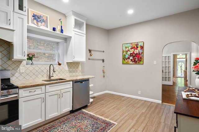 2332 E Baltimore St E, Baltimore, MD 21224 - kitchen with stainless steel appliances, a sink, backsplash, white cabinetry, and recessed lighting