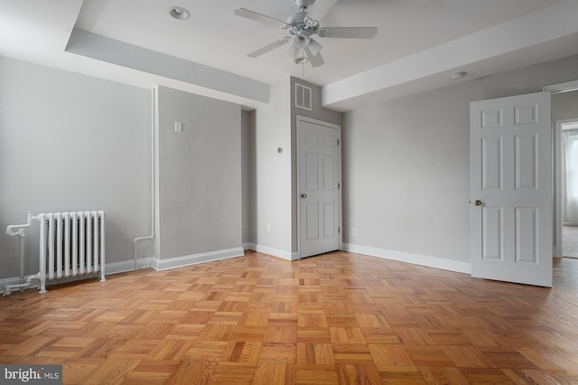 2332 E Baltimore St E, Baltimore, MD 21224 - unfurnished room with radiator, a ceiling fan, and baseboards