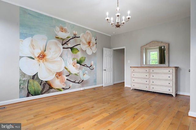 2332 E Baltimore St E, Baltimore, MD 21224 - unfurnished room featuring a chandelier, hardwood / wood-style flooring, and baseboards