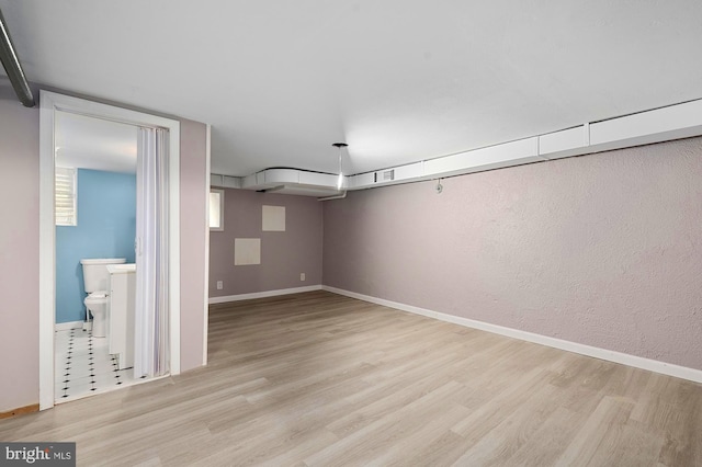 2332 E Baltimore St E, Baltimore, MD 21224 - basement featuring light wood-style floors and baseboards