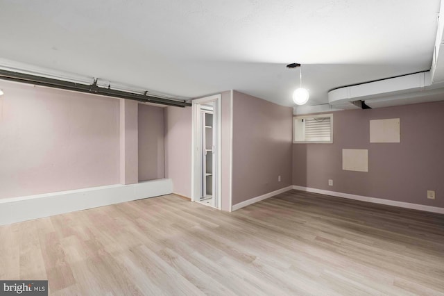 2332 E Baltimore St E, Baltimore, MD 21224 - finished basement featuring wood finished floors and baseboards