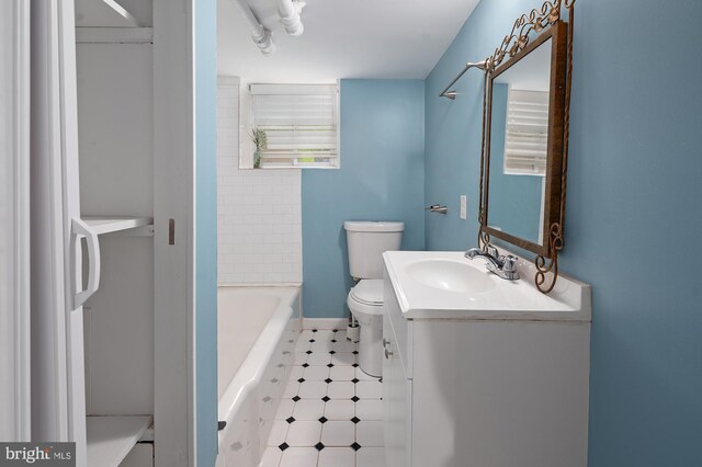 2332 E Baltimore St E, Baltimore, MD 21224 - bathroom with toilet, vanity, a bath, and a shower