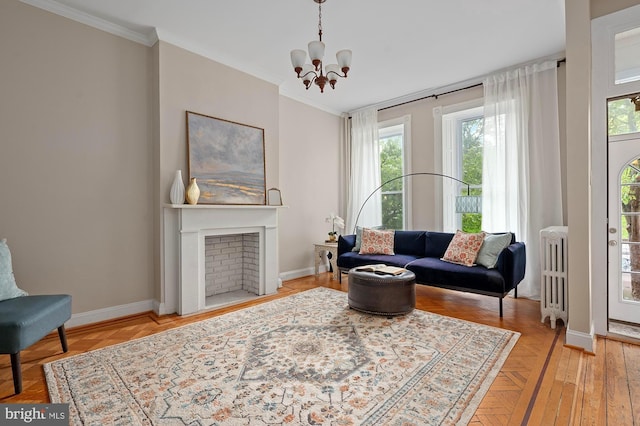 2332 E Baltimore St E, Baltimore, MD 21224 - living area with a chandelier, baseboards, crown molding, radiator heating unit, and a fireplace