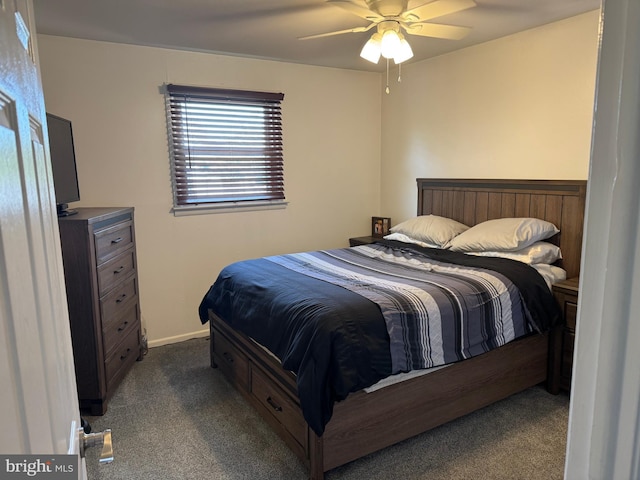 bedroom featuring dark colored carpet and ceiling fan