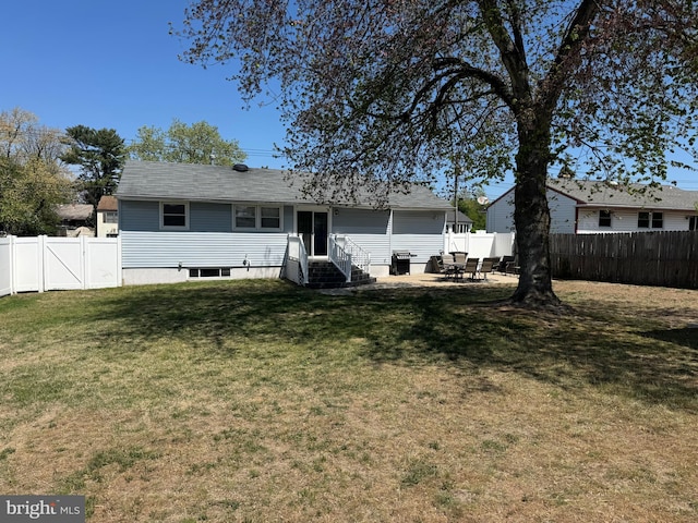 rear view of house featuring entry steps and a patio