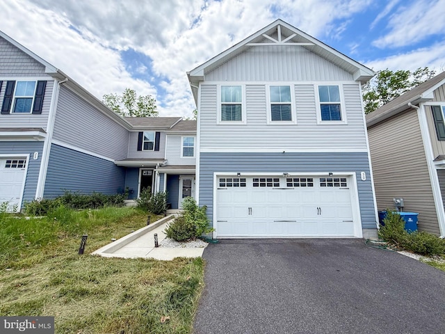 30 Sugarberry Dr, Elkton, MD 21921 - traditional-style house with asphalt driveway, an attached garage, and board and batten siding
