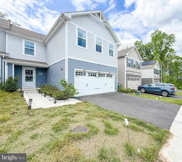 30 Sugarberry Dr, Elkton, MD 21921 - view of front facade with board and batten siding, a garage, and driveway