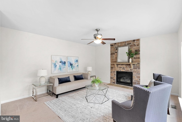 924 Towering Oak Ct, Purcellville, VA 20132 - living room with a ceiling fan, a stone fireplace, and baseboards