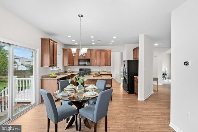 924 Towering Oak Ct, Purcellville, VA 20132 - dining area with a chandelier, recessed lighting, light wood finished floors, and baseboards