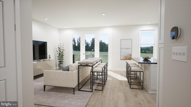 living room with light wood finished floors and recessed lighting