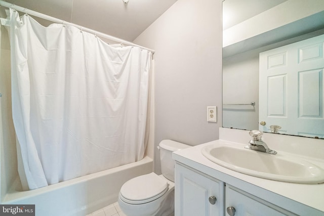 bathroom with toilet, vanity, and shower / tub combo