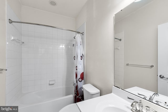 bathroom with toilet, shower / bath combination with curtain, and vanity