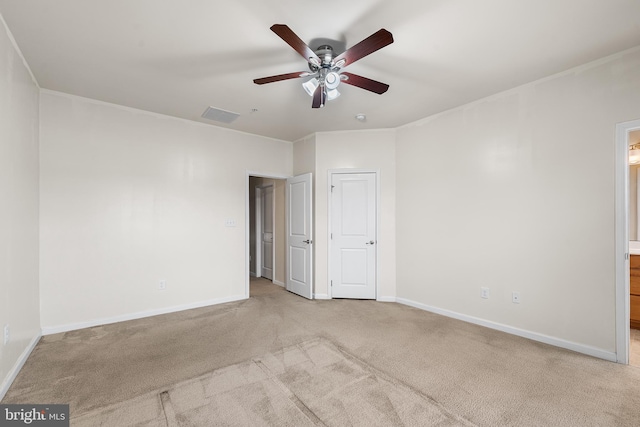 unfurnished bedroom with carpet, baseboards, and ensuite bath