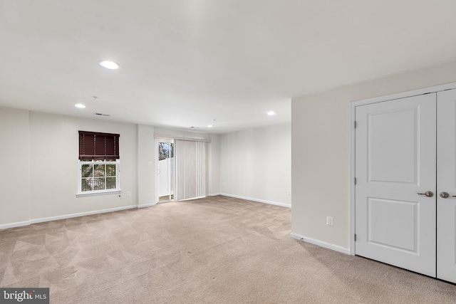 below grade area featuring recessed lighting, carpet, and baseboards
