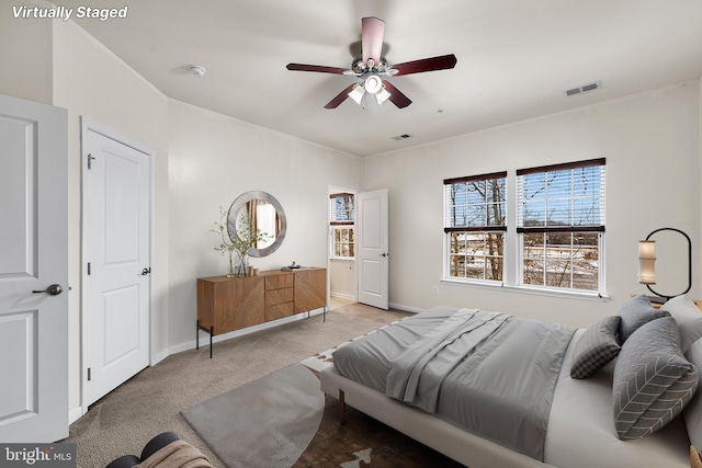 bedroom featuring carpet flooring, baseboards, and a ceiling fan