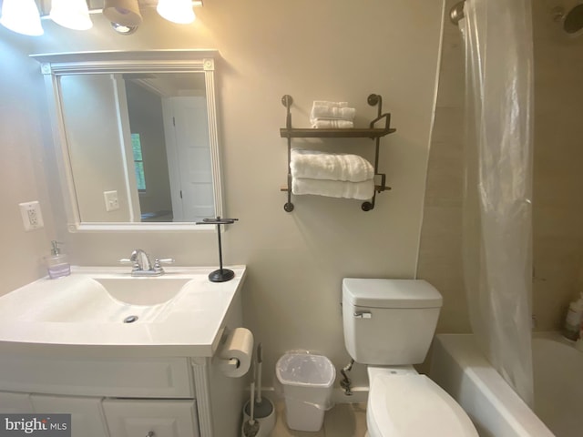 full bathroom featuring toilet, vanity, and shower / bathtub combination with curtain