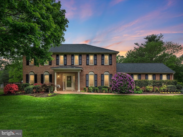 4002 Latham, Haymarket, VA 20169 - colonial-style house featuring a lawn, brick siding, and roof with shingles