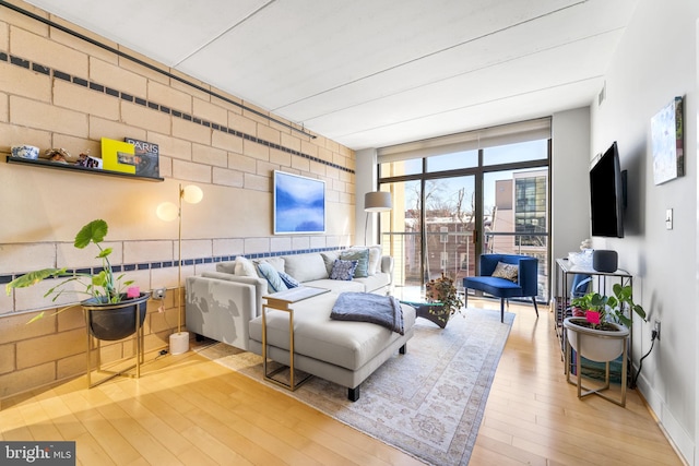 living room featuring hardwood / wood-style floors and floor to ceiling windows