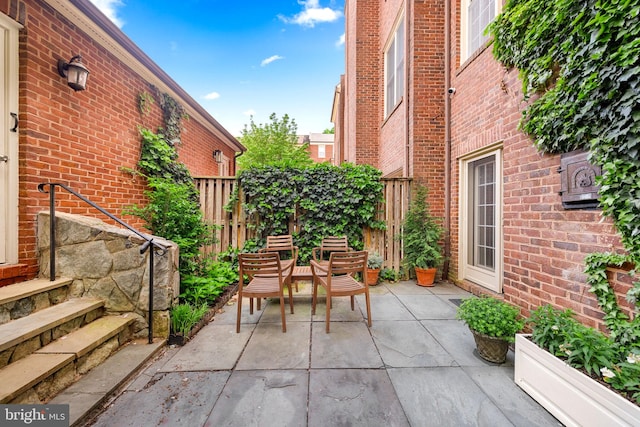view of patio / terrace featuring fence