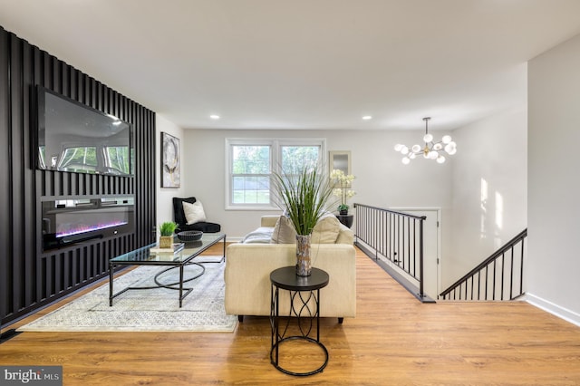 9815 Winands Rd, Randallstown, MD 21133 - living area with wood finished floors, a chandelier, baseboards, recessed lighting, and a glass covered fireplace