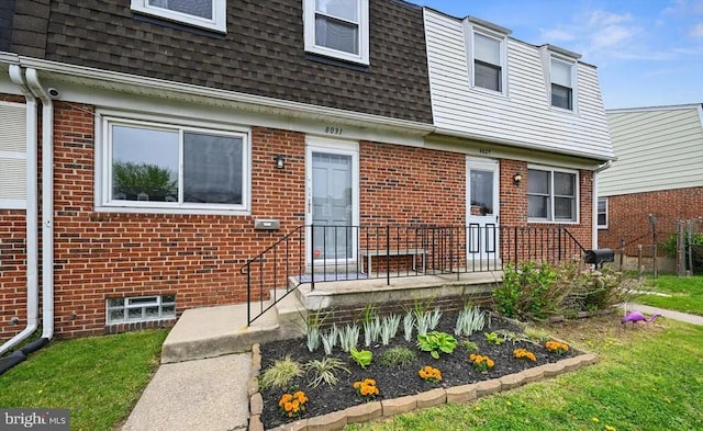 8031 Stratman Rd, Baltimore, MD 21222 - view of front of house featuring a shingled roof, brick siding, and mansard roof