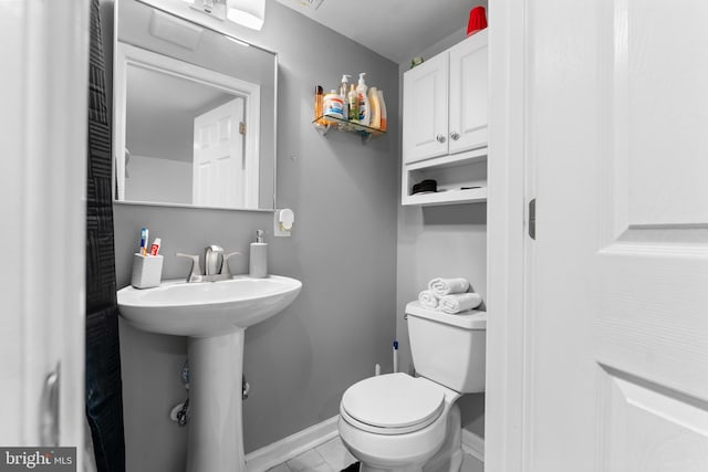 8031 Stratman Rd, Baltimore, MD 21222 - bathroom featuring toilet and baseboards