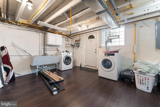 8031 Stratman Rd, Baltimore, MD 21222 - clothes washing area with washing machine and dryer, cabinet space, and dark wood-style floors