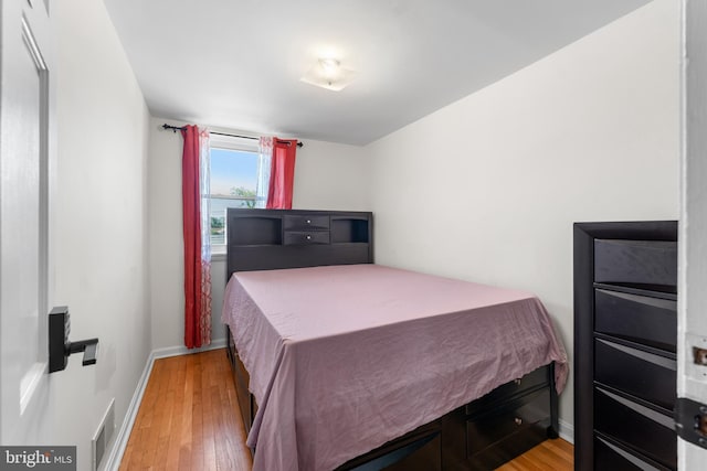 8031 Stratman Rd, Baltimore, MD 21222 - bedroom with light wood-type flooring and baseboards