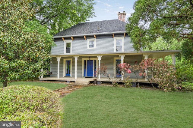 4901 40th Pl, Hyattsville, MD 20781 - back of house featuring a yard, a chimney, and a porch