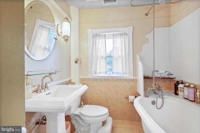 4901 40th Pl, Hyattsville, MD 20781 - full bath with a tub, a wainscoted wall, tile patterned floors, toilet, and tile walls