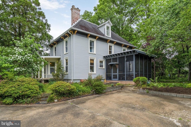 4901 40th Pl, Hyattsville, MD 20781 - rear view of property featuring a sunroom and a chimney