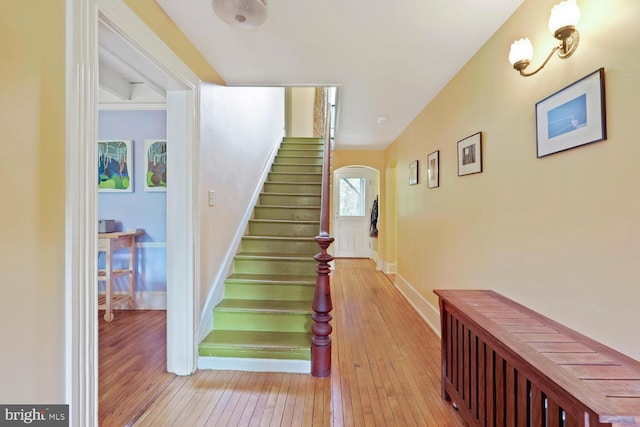 4901 40th Pl, Hyattsville, MD 20781 - staircase with wood-type flooring, arched walkways, and baseboards