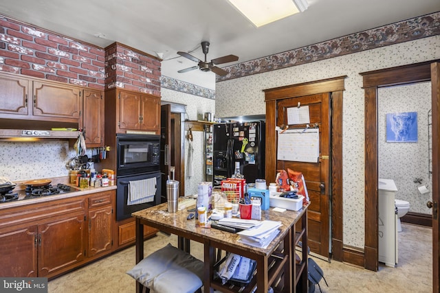 16 N Maple Ave, Smithsburg, MD 21783 - kitchen with wallpapered walls, black appliances, under cabinet range hood, ceiling fan, and light countertops