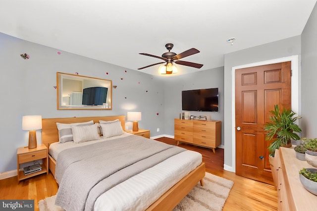 16 N Maple Ave, Smithsburg, MD 21783 - bedroom featuring baseboards, light wood-style floors, and a ceiling fan