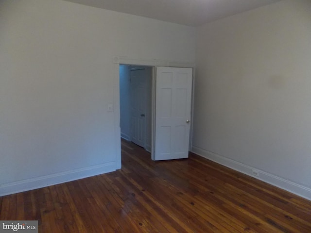 716 N Milton Ave, Baltimore, MD 21205 - unfurnished room with dark wood finished floors and baseboards