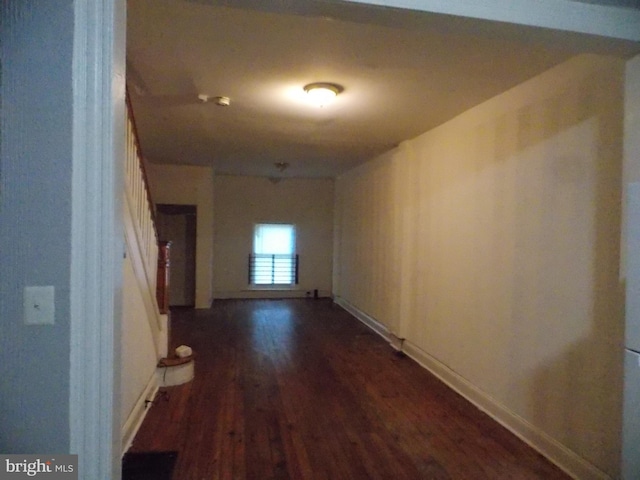 716 N Milton Ave, Baltimore, MD 21205 - corridor with dark wood-style floors and baseboards