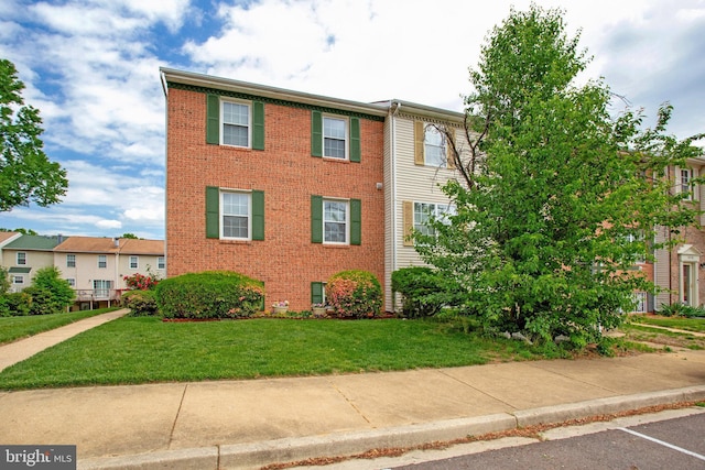 10734 Castleton Way, Upper Marlboro, MD 20774 - townhome / multi-family property featuring brick siding and a front yard