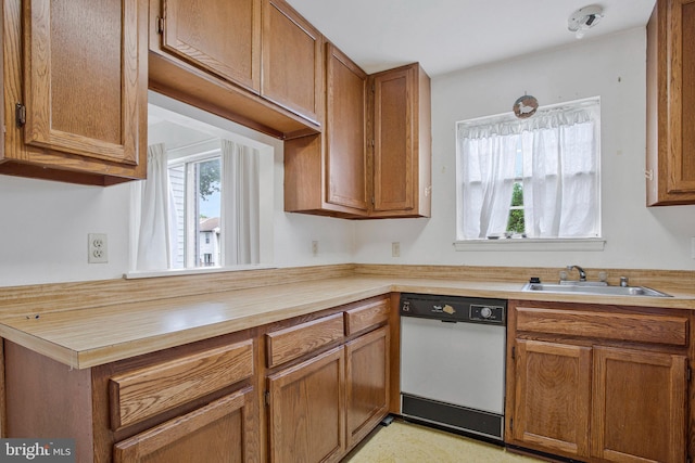 10734 Castleton Way, Upper Marlboro, MD 20774 - kitchen featuring white dishwasher, a sink, butcher block countertops, and brown cabinetry